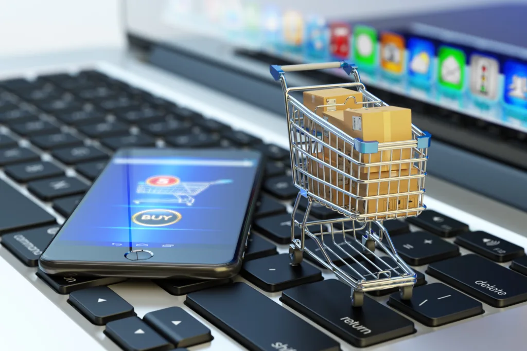 Customer using smartphone and laptop for omnichannel shopping